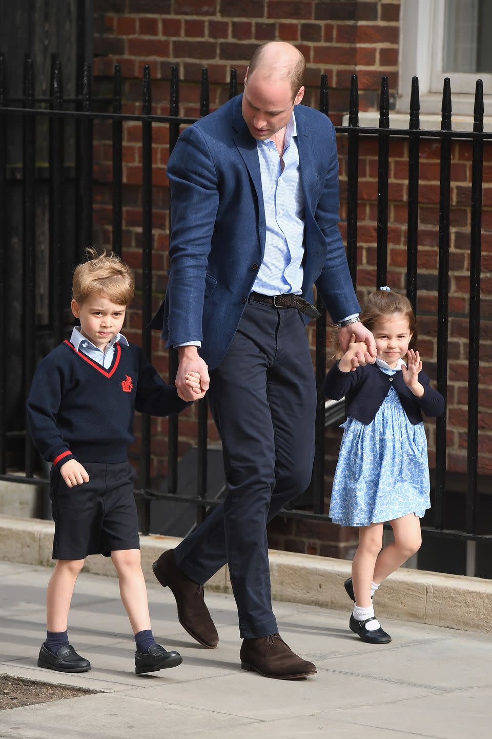 <p><a href="https://www.townandcountrymag.com/society/tradition/g19723493/prince-george-princess-charlotte-royal-baby-3-photos-lindo-wing/" rel="nofollow noopener" target="_blank" data-ylk="slk:Prince George arrives at St. Mary's Hospital;elm:context_link;itc:0;sec:content-canvas" class="link ">Prince George arrives at St. Mary's Hospital</a> in London with dad Prince William and Princess Charlotte to meet his newborn brother! The little royal was in his school uniform. </p>
