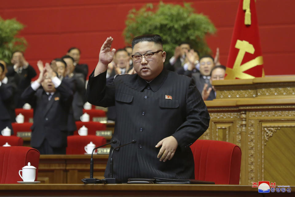 In this photo provided by the North Korean government, North Korean leader Kim Jong Un acknowledges to the applauds after he made his closing remarks at a ruling party congress in Pyongyang, North Korea Tuesday, Jan. 12, 2021. Kim vowed all-out efforts to bolster his country's nuclear deterrent during the major ruling party meeting where he earlier laid out plans to work toward salvaging the broken economy. Independent journalists were not given access to cover the event depicted in this image distributed by the North Korean government. The content of this image is as provided and cannot be independently verified. Korean language watermark on image as provided by source reads: "KCNA" which is the abbreviation for Korean Central News Agency. (Korean Central News Agency/Korea News Service via AP)