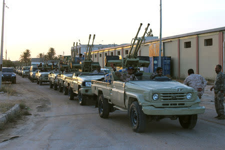 Military vehicles of members of the Libyan internationally recognised government forces head out from Misrata to the front line in Tripoli, Misrata, Libya May 10, 2019. REUTERS/Ayman Al-Sahili