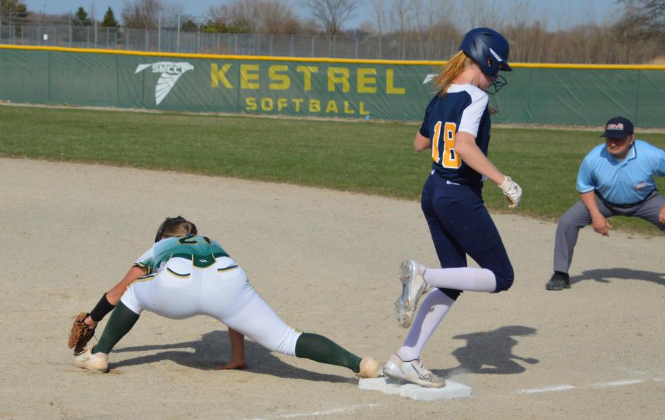 Airport's Haley Boitnott beats a throw to first base during a 7-6 loss to St. Mary Catholic Central Tuesday. SMCC first baseman Cami Carnes stretches for the throw.