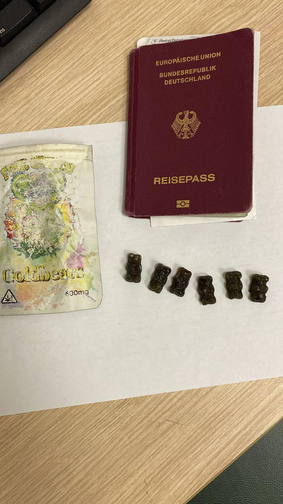 This photo released by Russian Federal Customs Service on Wednesday, Feb. 14, 2024, shows Patrick Schobel's national passport and cannabis gummies found on him during examination at Pulkovo airport outside St. Petersburg, Russia. A Moscow court has remanded a German citizen into custody after his arrest for possession of cannabis gummies and accusations of smuggling drugs. Russian state news agency Tass says Patrick Schobel was detained at Pulkovo airport in St. Petersburg and will remain in custody until at least March 15. (Russian Federal Customs Service via AP)