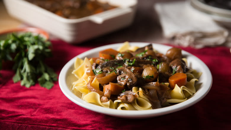 mushroom stew served over noodles 