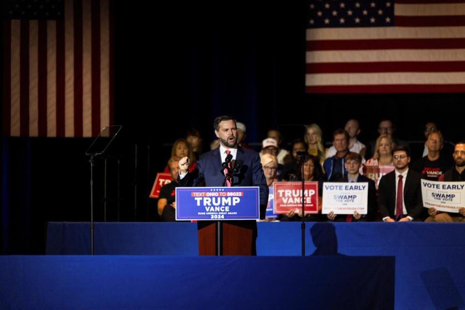 J.D. Vance in front of lectern marked Trump-Pence