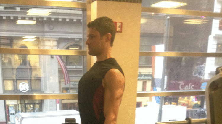gif showing Evan Kleinman demonstrating how to do a barbell deadlift exercise