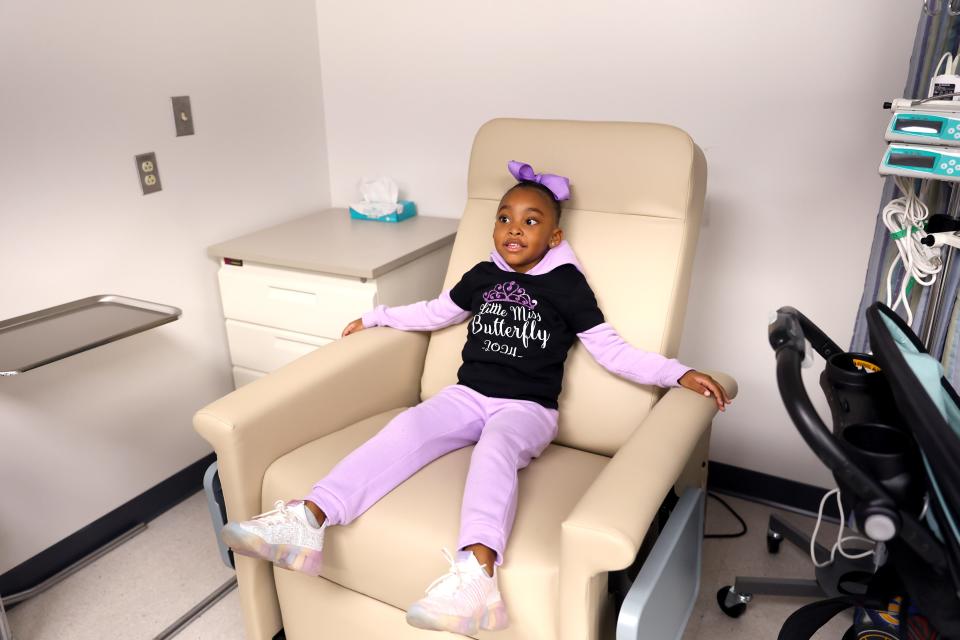 Chloe Dawkins sits in a chair during the ONE Lupus Support Group tour of the Oklahoma Medical Research Foundation in Oklahoma City.