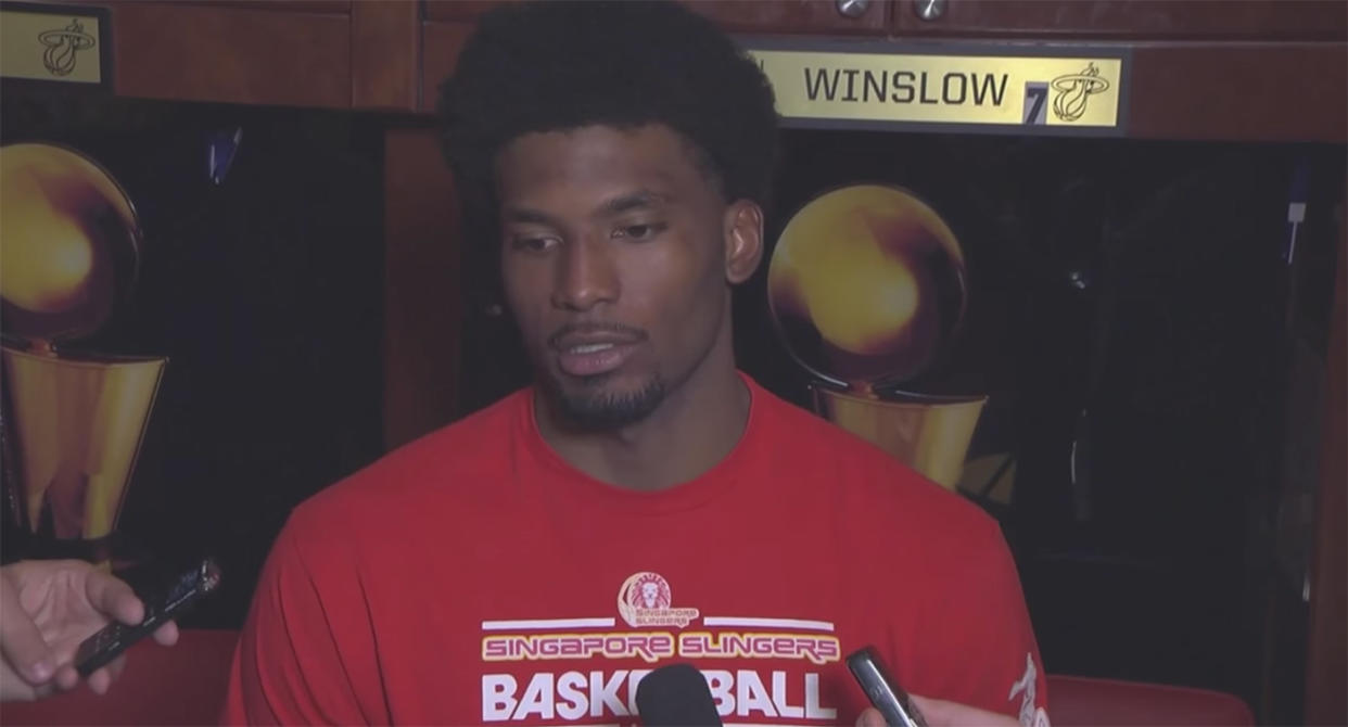 Miami Heat forward Justise Winslow wearing a memento of his time in Singapore. Screenshot: FoxSports Florida/YouTube