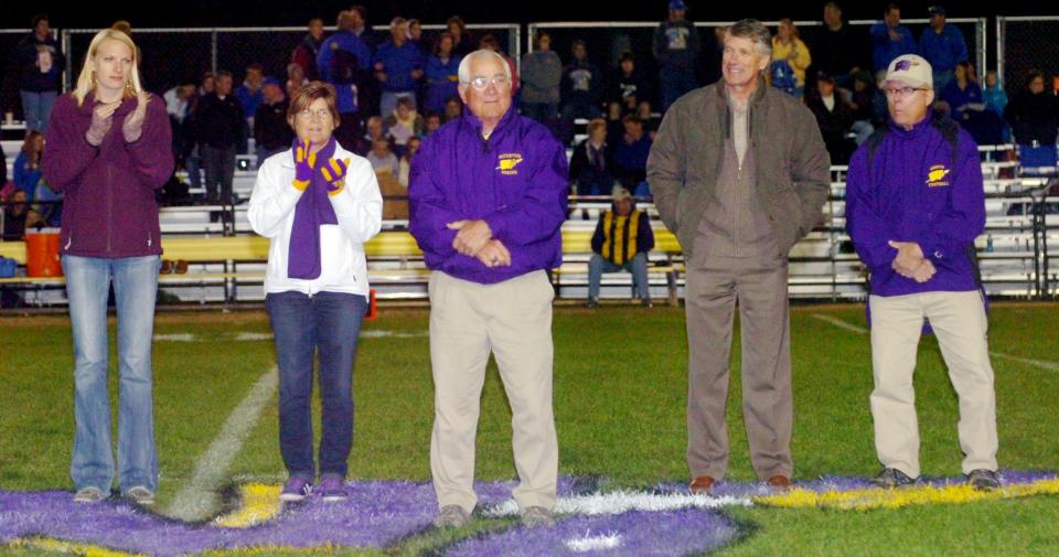Former Watertown High School athletic director Harvey Hammrich (center) is pictured at the 2011 WHS homecoming football game along with other inductees chosen for the WHS Athletic Hall of Fame. Hammrich, who passed away in 2021, is one of 23 people chosen to be inducted this year into the South Dakota Sports Hall of Fame.