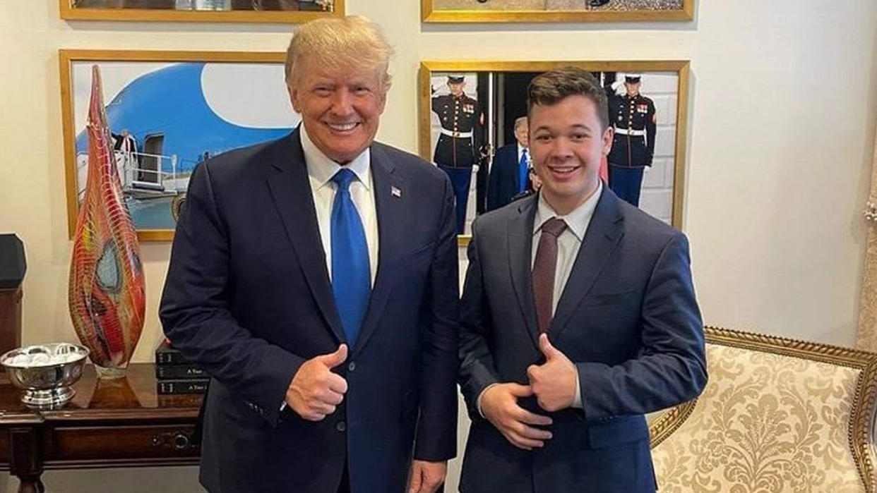 Donald Trump and Kyle Rittenhouse smile with thumbs up as they pose in front of pictures of Trump at Mar-a-Lago.