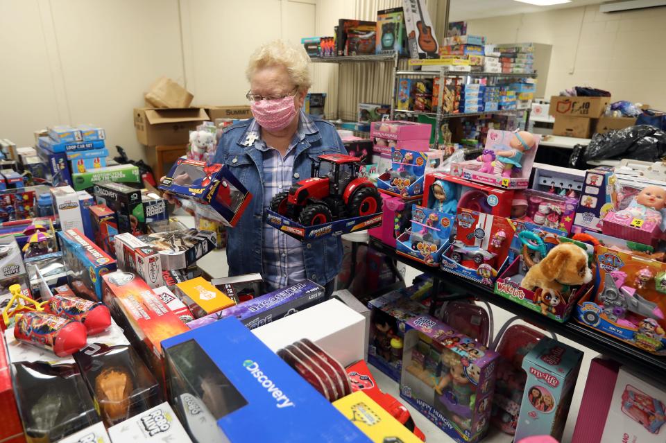 Beth Archer looks over the children's toys for Angel Tree program in this TR file photos. Archer joined the auxiliary after retiring from teaching. She has served as president of the organization for many years.