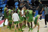 Oregon players celebrate following a second-round game against Iowa. in the NCAA men's college basketball tournament at Bankers Life Fieldhouse, Monday, March 22, 2021, in Indianapolis. Oregon won 95-80. (AP Photo/Darron Cummings)