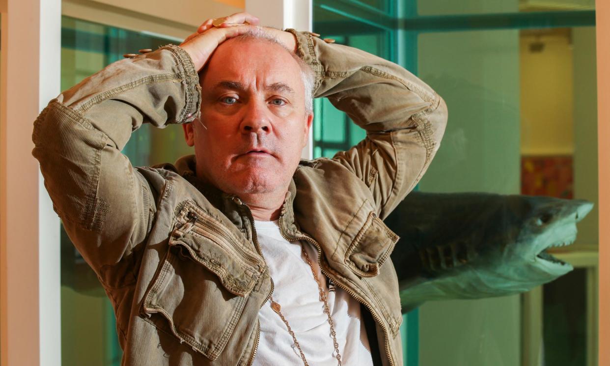 <span>Damien Hirst pictured in November 2017 in front of Myth Explored, Explained, Exploded at the Gagosian in Hong Kong.</span><span>Photograph: South China Morning Post/Getty Images</span>