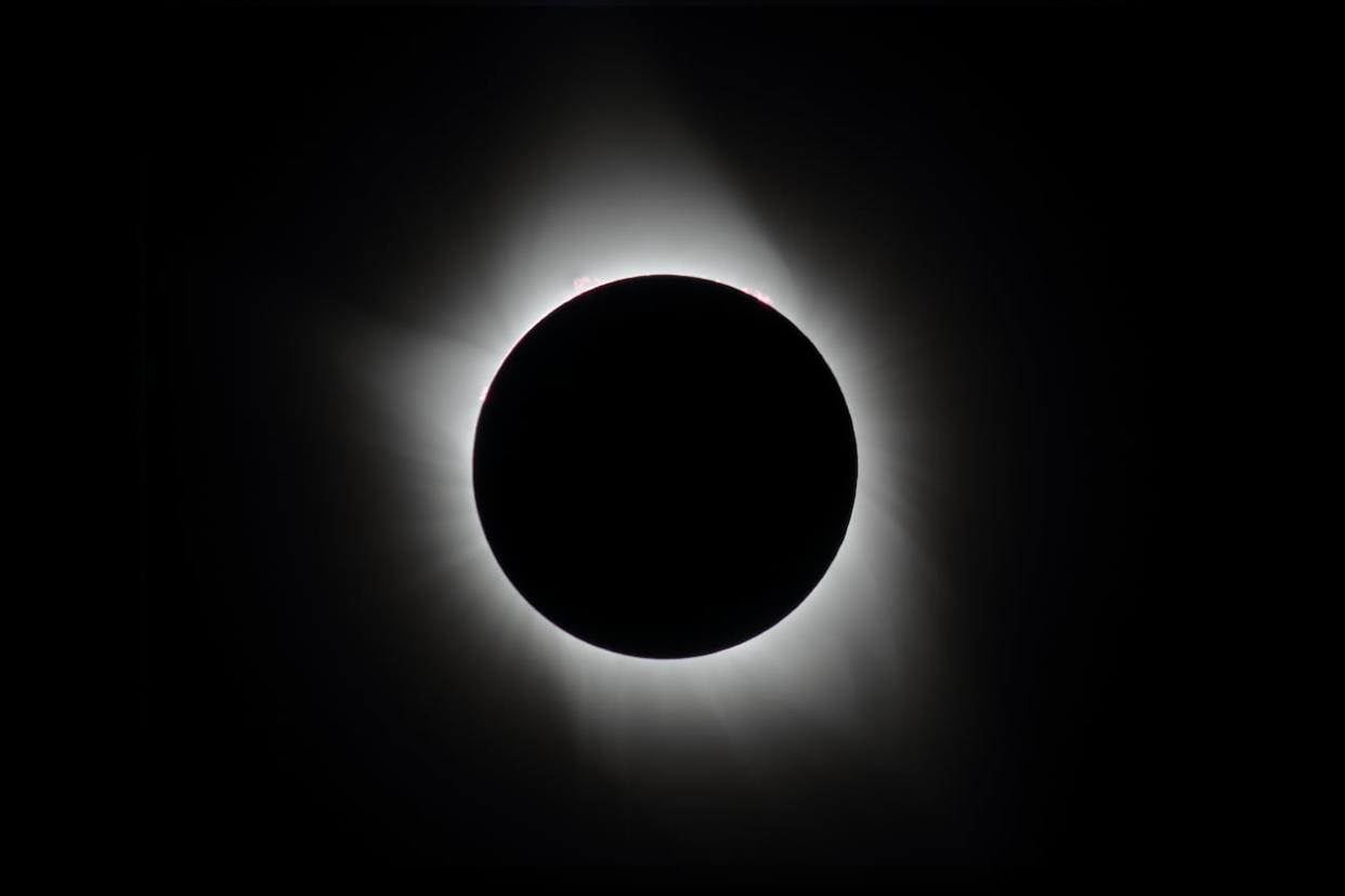 A photo of the total solar eclipse on Aug. 21, 2017, shows the sun's outer atmosphere — a white ring called the corona — peeking out behind the moon. On Monday, several locations in New Brunswick will have a front-row seat to the total solar eclipse. (Submitted by Philippe Moussette - image credit)