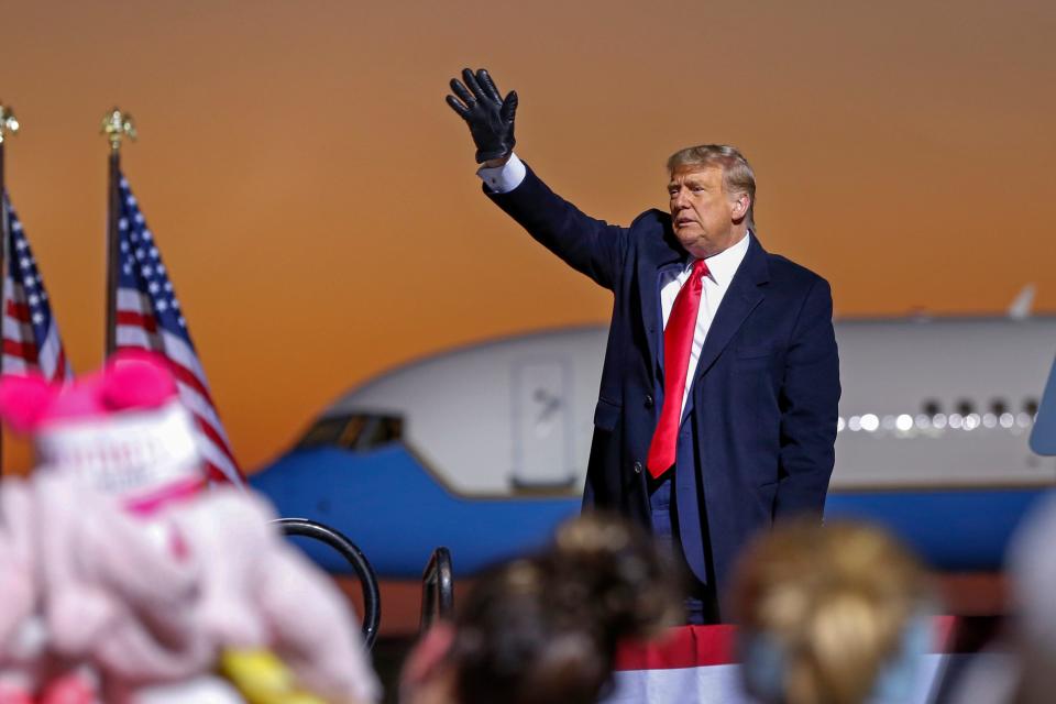 President Donald Trump waves farewell to the crowd at a campaign rally Friday, Oct. 30, 2020 in Rochester, Minn.