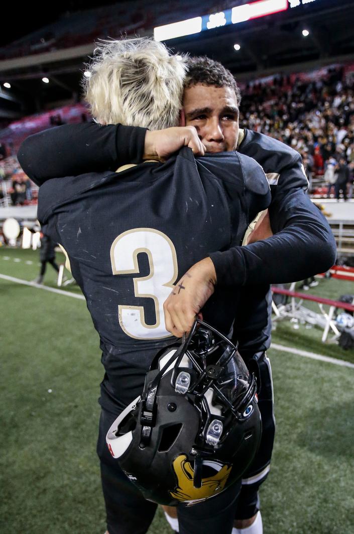 Franklin running back Tanner Rivard (3) and quarterback Myles Burkett are overcome with emotion after winning the WIAA Division 1 football state championship at Camp Randall Stadium in Madison on Friday, Nov. 19, 2021.