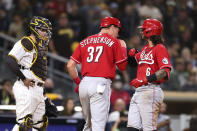 Cincinnati Reds' Jonathan India, right, celebrates with Tyler Stephenson (37) after hitting a two-run home run in the ninth inning of the team's baseball game against the San Diego Padres on Thursday, June 17, 2021, in San Diego. (AP Photo/Derrick Tuskan)