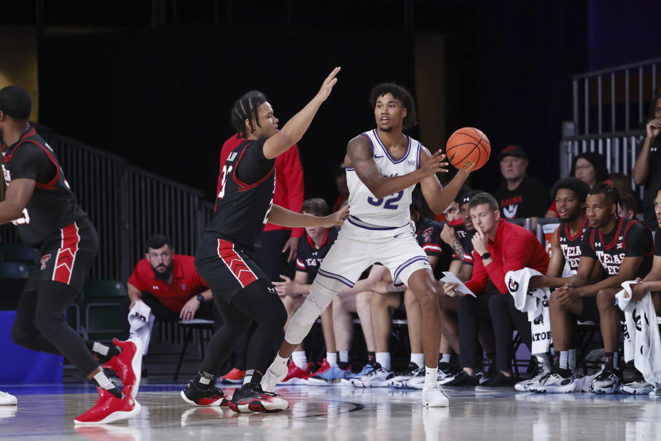 In this photo provided by Bahamas Visual Services, Northern Iowa's Tytan Anderson looks to pass the ball around Texas Tech's Eemeli Yalaho during an an NCAA college basketball game in the Battle 4 Atlantis at Paradise Island, Bahamas, Thursday, Nov. 23, 2023. (Tim Aylen/Bahamas Visual Services via AP)