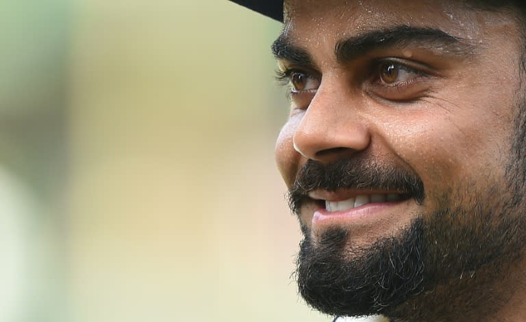 Indian captain Virat Kohli celebrates victory in the third and decisive Test against Sri Lanka in Colombo on September 1, 2015