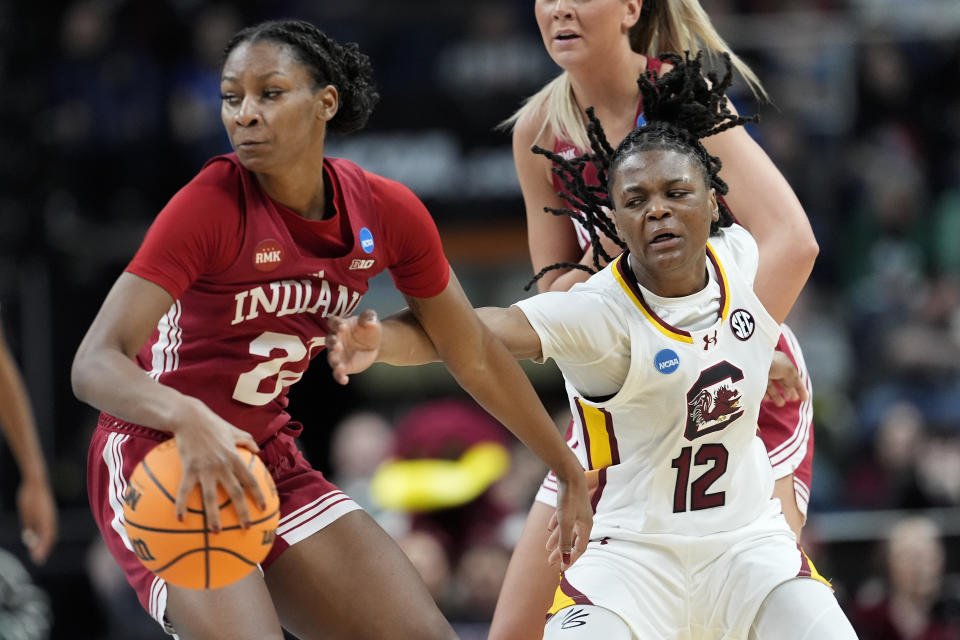 South Carolina guard MiLaysia Fulwiley (12) tries to strip the ball from Indiana guard Chloe Moore-McNeil (22) during the first quarter of a Sweet Sixteen round college basketball game during the NCAA Tournament, Friday, March 29, 2024, in Albany, N.Y. (AP Photo/Mary Altaffer)
