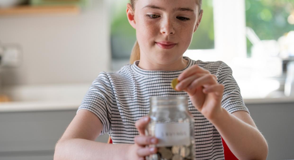 A TikTok user is making her daughter pay 'bills' from the pocket money she's earned (posed by model, Getty)