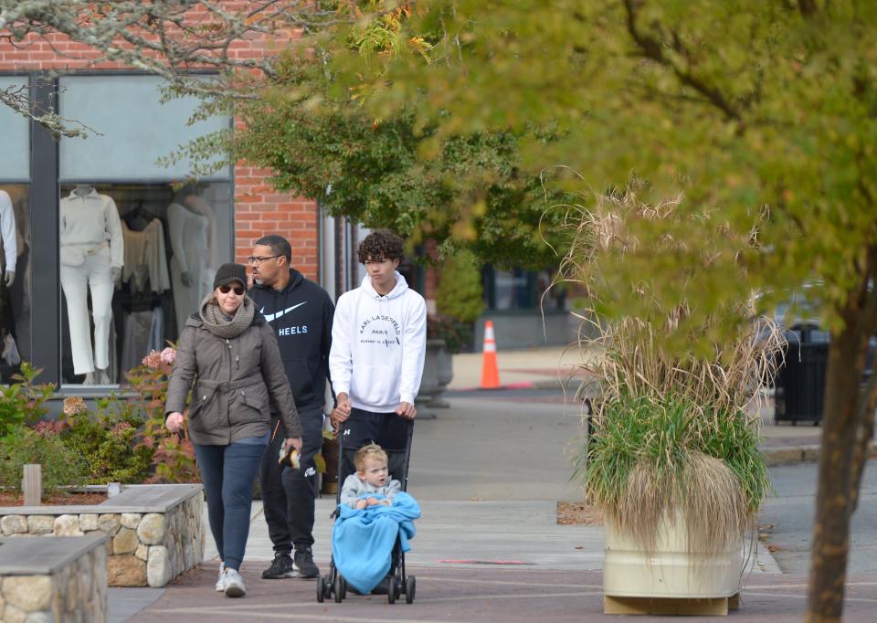 David and Jen Araujo, of Mashpee, walk with their sons Ryan, 17, and Tommy, 4, in Mashpee Commons during "Walk for Water" fundraising event. "Walk for Water" was held Sunday morning. Mashpee Commons hosted Mashpee High School Key Club's fundraising event. Proceeds will benefit the Thirst Project, the world’s leading youth water activism organization. Participants were able to walk a one-mile or two-mile course through Mashpee Commons. The Thirst Project is a non-profit organization that works with the support of young people to end the global water crisis by building freshwater wells in developing communities that need safe, clean drinking water.
