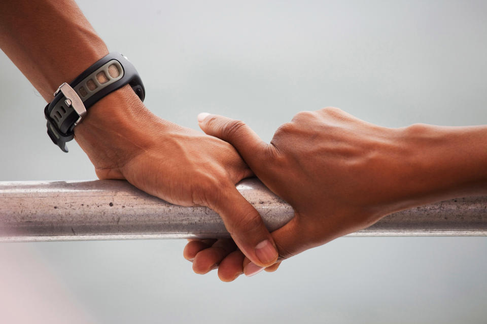 President Barack Obama and first lady Michelle Obama's hands rest on the railing of a boat during their tour of St. Andrews Bay in Panama City Beach, Florida&nbsp;on Aug. 15, 2010.