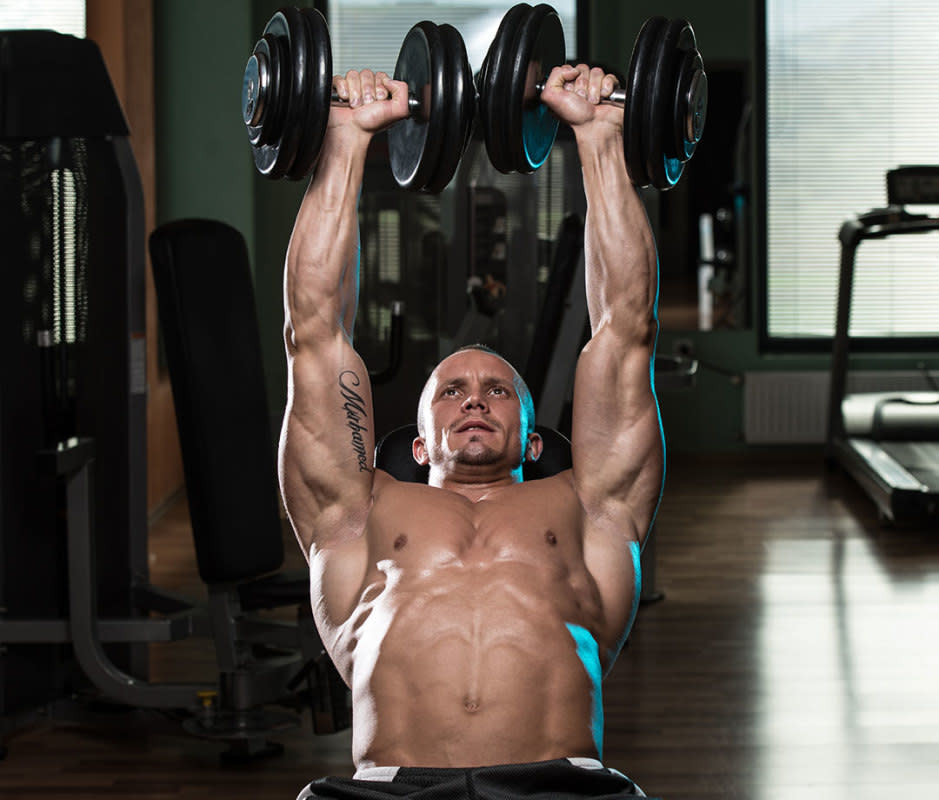 <p>Ibrakovic/Getty Images</p>How to Do It<ol><li>Set a bench to an incline of 45 degrees with dumbbells resting on top of your legs, to start.</li><li>Sit back against the bench and kick your legs up to help drive the weights to your shoulders. Inhale, then press your feet into the floor as you drive the weights up toward the ceiling, exhaling at the top of the movement.</li><li>With control, lower the weights to the start position. That's 1 rep.</li></ol>