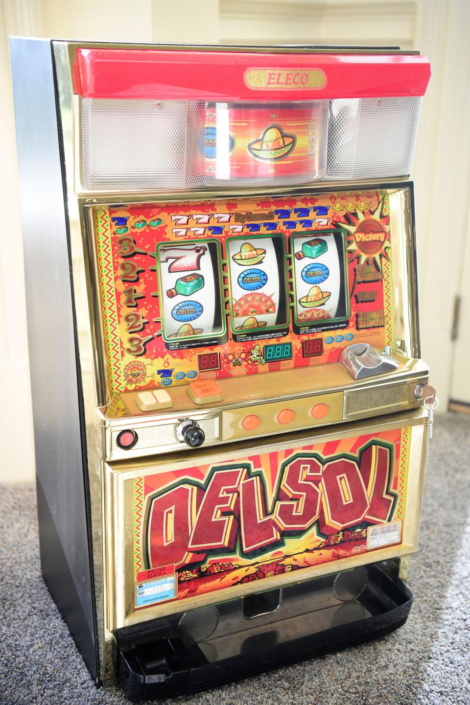 This slot machine, complete with tokens, will soon be available for bidding. An online auction of items from Villa Collina will take place Dec. 4 before Knoxville's largest home is eventually demolished and replaced with three smaller homes.