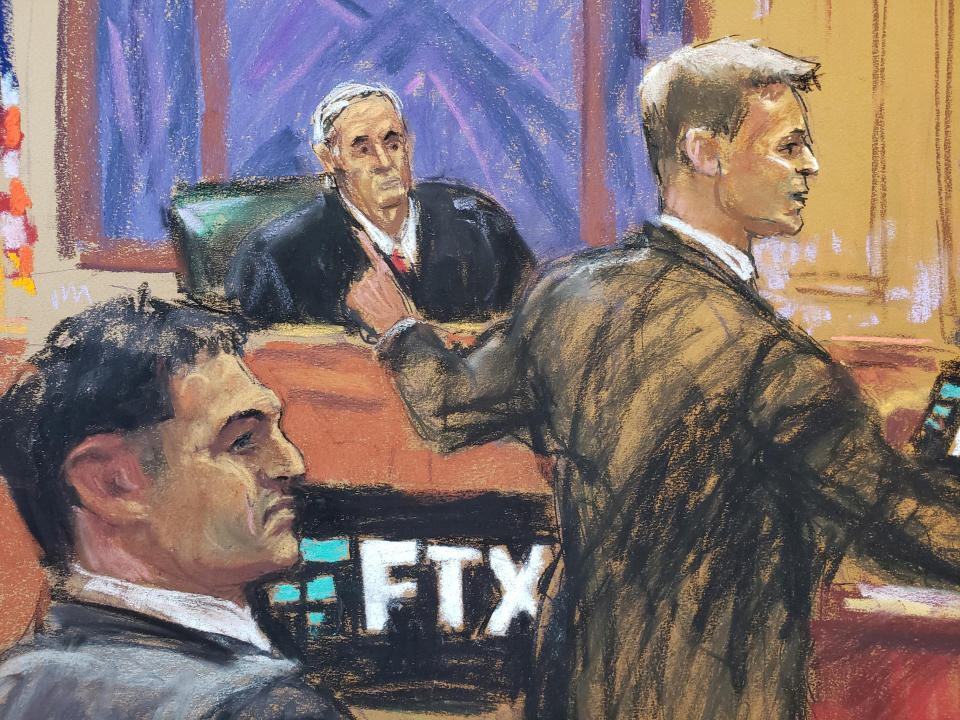 Sam Bankman-Fried watches as defense lawyer Mark Cohen makes his opening remark in Bankman-Fried's fraud trial over the collapse of FTX, the bankrupt cryptocurrency exchange, at Federal Court in New York City, U.S., October 4, 2023 in this courtroom sketch. REUTERS/Jane Rosenberg