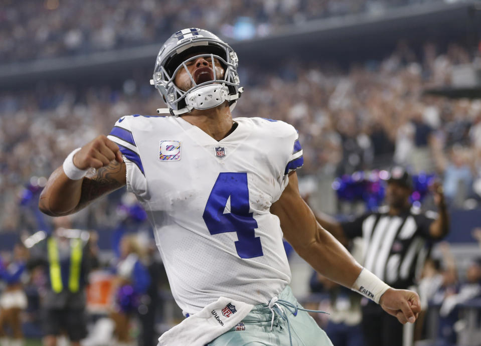 Cowboys quarterback Dak Prescott celebrates after a touchdown in the first half of their 40-7 victory over the Jaguars. (AP)