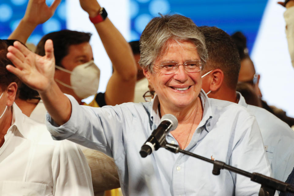 Guillermo Lasso, presidential candidate of Creating Opportunities party, CREO, speaks to supporters after a presidential runoff election at his campaign headquarters in Guayaquil, Ecuador, Sunday, April 11, 2021. With most of the votes counted Lasso, a former banker, had a lead over economist Andres Arauz, a protege of former President Rafael Correa.(AP Photo/Angel Dejesus)