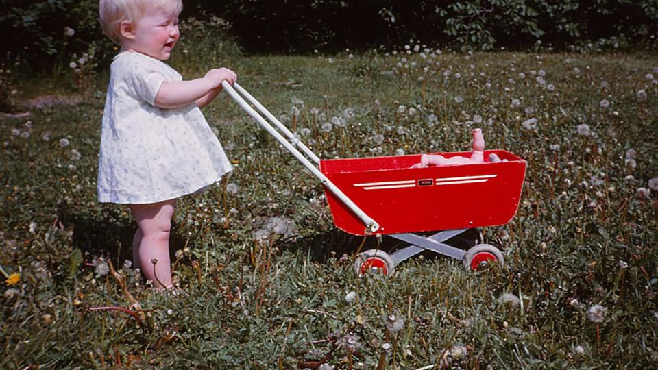 baby with red pram