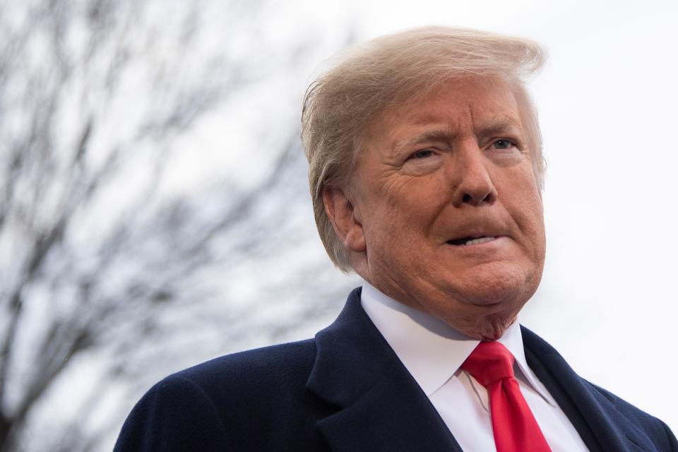 TOPSHOT - US President Donald Trump speaks to the media as he departs the White House in Washington, DC, on January 14, 2019 en route to New Orleans, Louisiana to address the annual American Farm Bureau Federation convention. - US President Donald Trump said Monday he has "never worked for Russia," assailing reports that raised questions about his ties to Vladimir Putin as a "big fat hoax."Trump's comments to reporters at the White House followed a Washington Post report over the weekend that said the president has kept his top aides in the dark about his private conversations with the Russian leader. (Photo by Jim WATSON / AFP) (Photo by JIM WATSON/AFP via Getty Images)