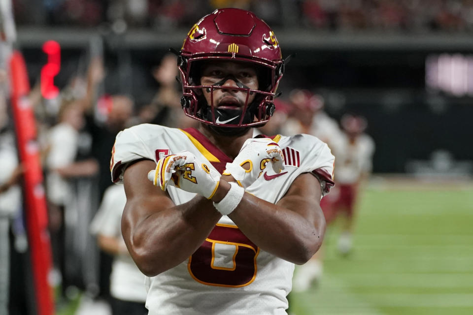 Iowa State wide receiver Xavier Hutchinson (8) celebrates after scoring against UNLV during the first half of an NCAA college football game Saturday, Sept. 18, 2021, in Las Vegas. (AP Photo/John Locher)