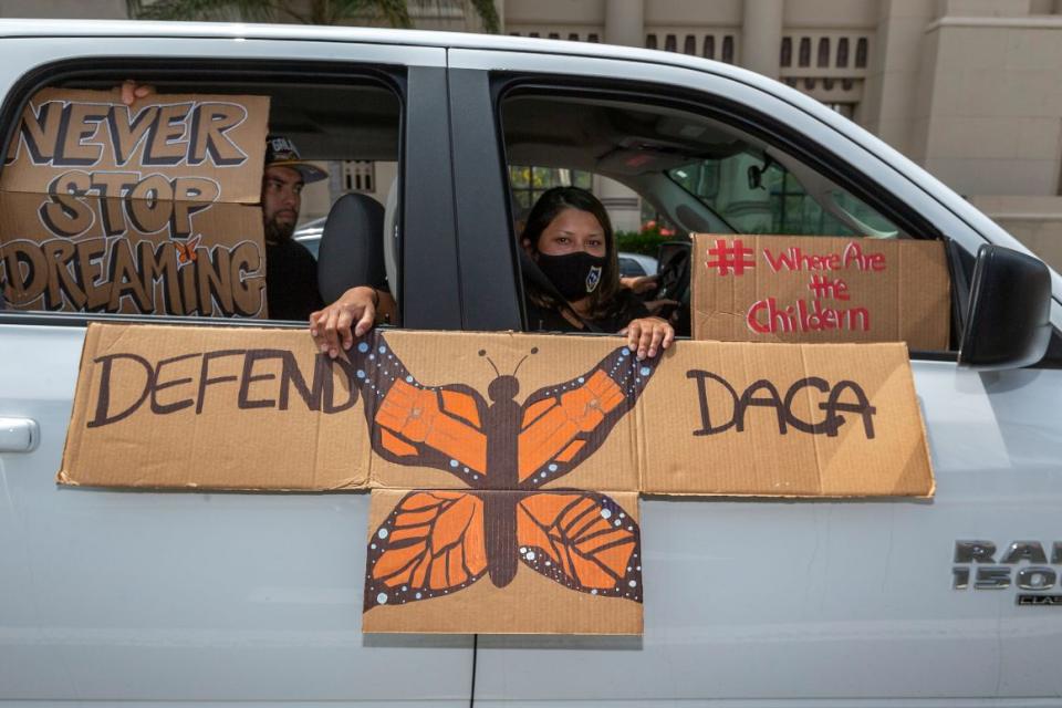 An immigrant family joins members of the Coalition for Humane Immigrant Rights of Los Angeles on a vehicle caravan rally to support the Deferred Action for Childhood Arrivals Program in Los Angeles on June 18 | AP Photo