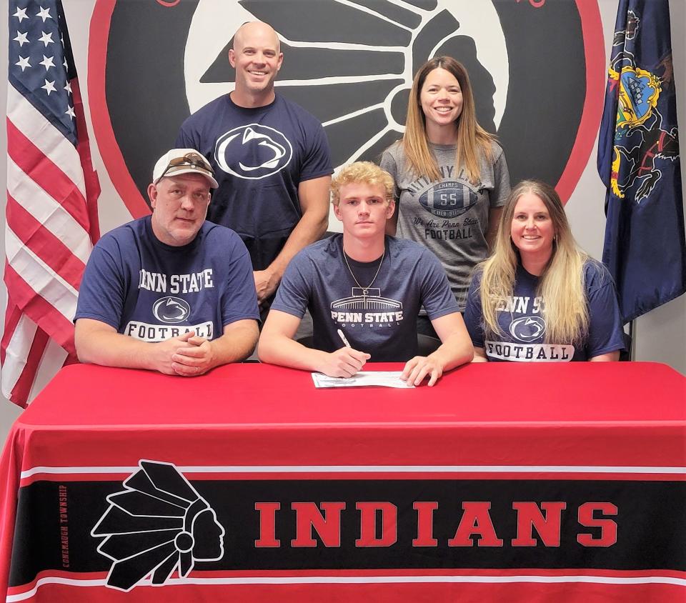 Flanked by parents Gary and Leisha Black, Conemaugh Township senior Ethan Black announces his intentions to play football at Penn State University, May 23, in Davidsville. In back, Black's uncle Chris Tresnicky and Conemaugh Township trainer Jenilee Lasure.