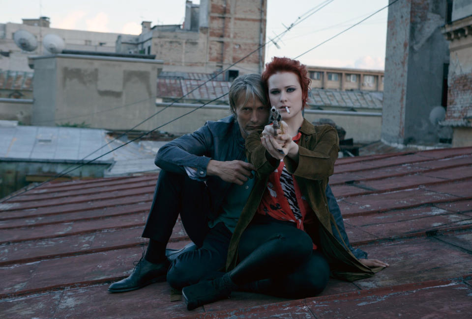 This image released by Millenium Entertainment shows Mads Mikkelsen, left, and Evan Rachel Wood in a scene from "Charlie Countryman," about a man who falls for a woman who belongs to a violent crime boss. (AP Photo/Millenium Entertainment)