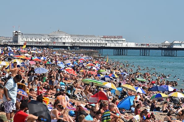 Beachgoers pack the beach in Brighton, on the south coast of England.