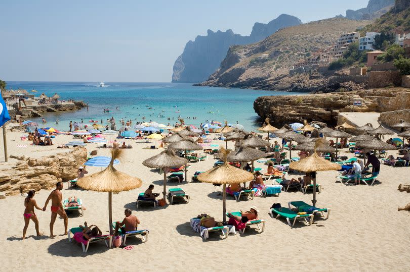 Tourists in Majorca have been confronted by locals after they were spotted walking around in bikinis and swimming trunks -Credit:Getty