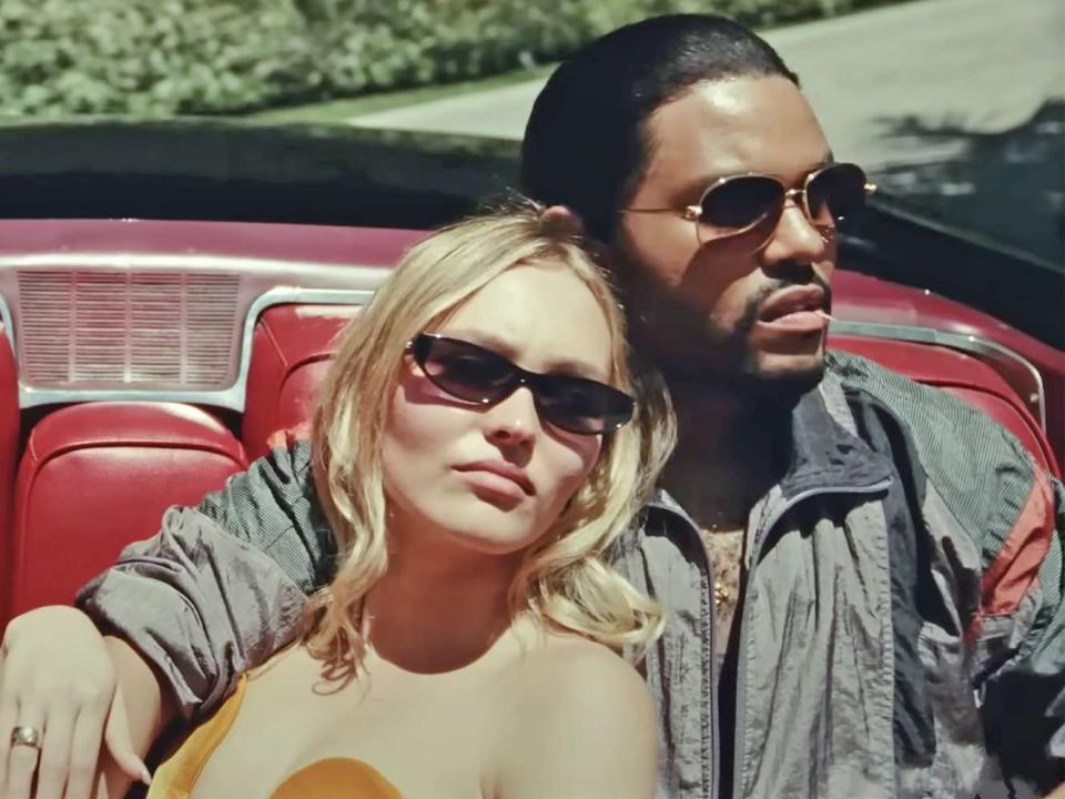 Lily-Rose Depp leaning on Abel "The Weeknd" Tesfaye's shoulder in a car on "The Idol"