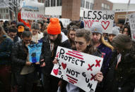 <p>Students at Yarmouth High School observe a moments of silence in honor of those killed in the Parkland, Fla. school shooting during a walkout to protest gun violence, Wednesday, March 14, 2018, in Yarmouth, Maine. (Photo: Robert F. Bukaty/AP) </p>