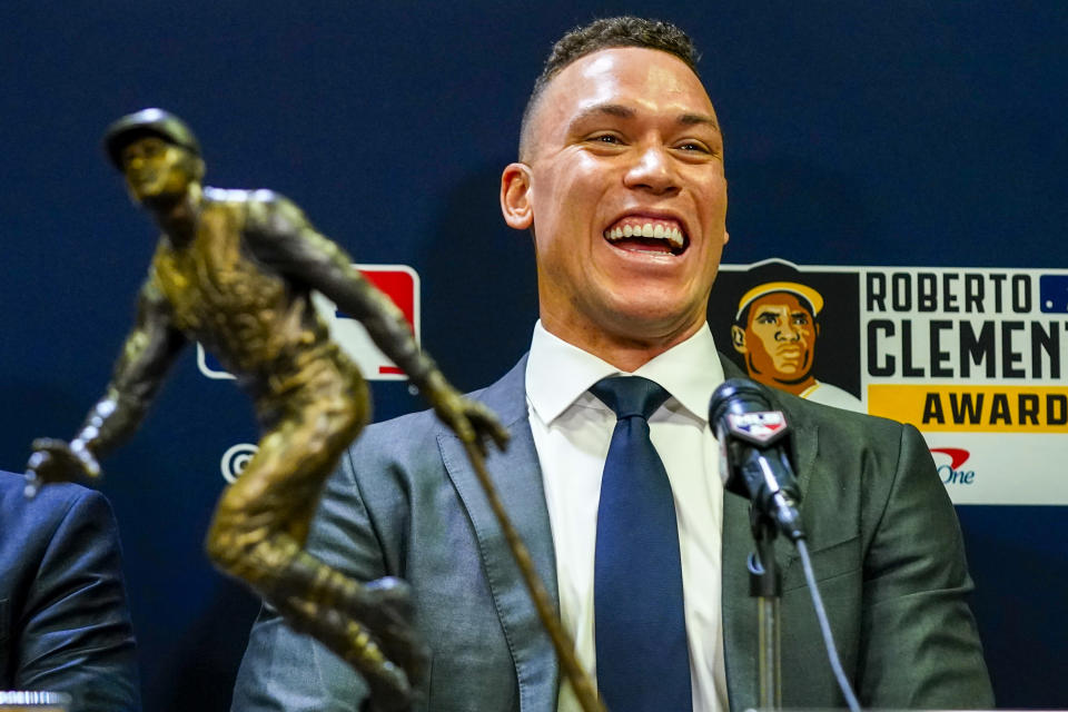 New York Yankees' Aaron Judge smiles after he was named the 2023 Recipient of the Roberto Clemente Award before Game 3 of the baseball World Series between the Arizona Diamondbacks and the Texas Rangers Monday, Oct. 30, 2023, in Phoenix. (AP Photo/Ross D. Franklin)