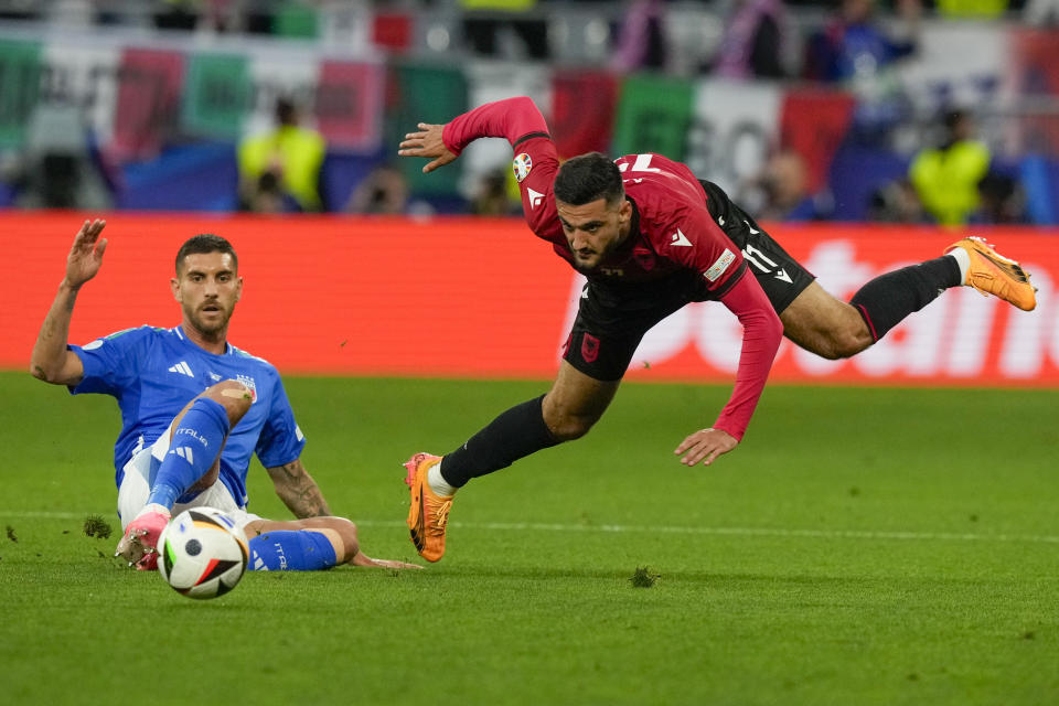 Albania's Armando Broja, right, and Italy's Lorenzo Pellegrini fight for the ball during a Group B match between Italy and Albania at the Euro 2024 soccer tournament in Dortmund, Germany, Saturday, June 15, 2024. (AP Photo/Frank Augstein)