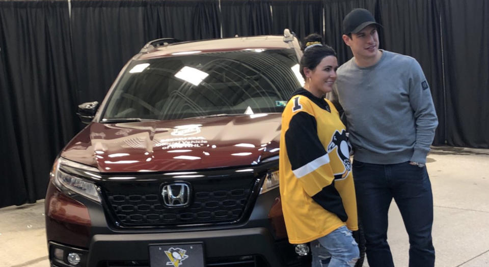Sidney Crosby of the Pittsburgh Penguins poses with Madeline Malizio after surprising the veteran with a new car.