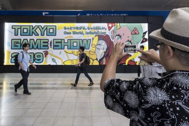 CHIBA, JAPAN - SEPTEMBER 12:  An attendee takes a photograph of signage of the Tokyo Game Show 2019 during the business day at Makuhari Messe on September 12, 2019 in Chiba, Japan. The Tokyo Game Show will be open to the public on September 14 and 15, 2019. (Photo by Tomohiro Ohsumi/Getty Images)