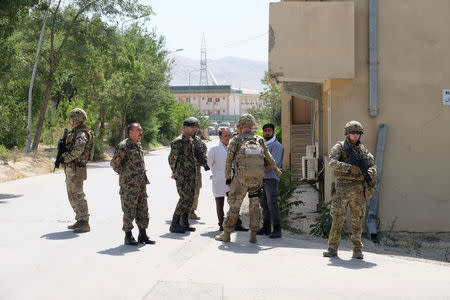 Soldiers with the British army's Royal Irish Regiment provide security for a meeting between international military advisers and Afghan officials at a base in Kabul, Afghanistan July 12, 2017. REUTERS/Josh Smith