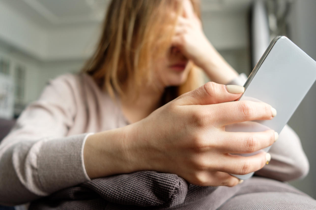 Upset girl with a phone