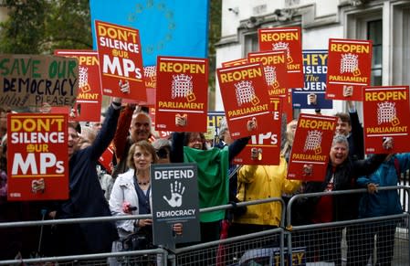 Demonstrators react on the ruling of the Supreme Court during a protest outside the Supreme Court in London