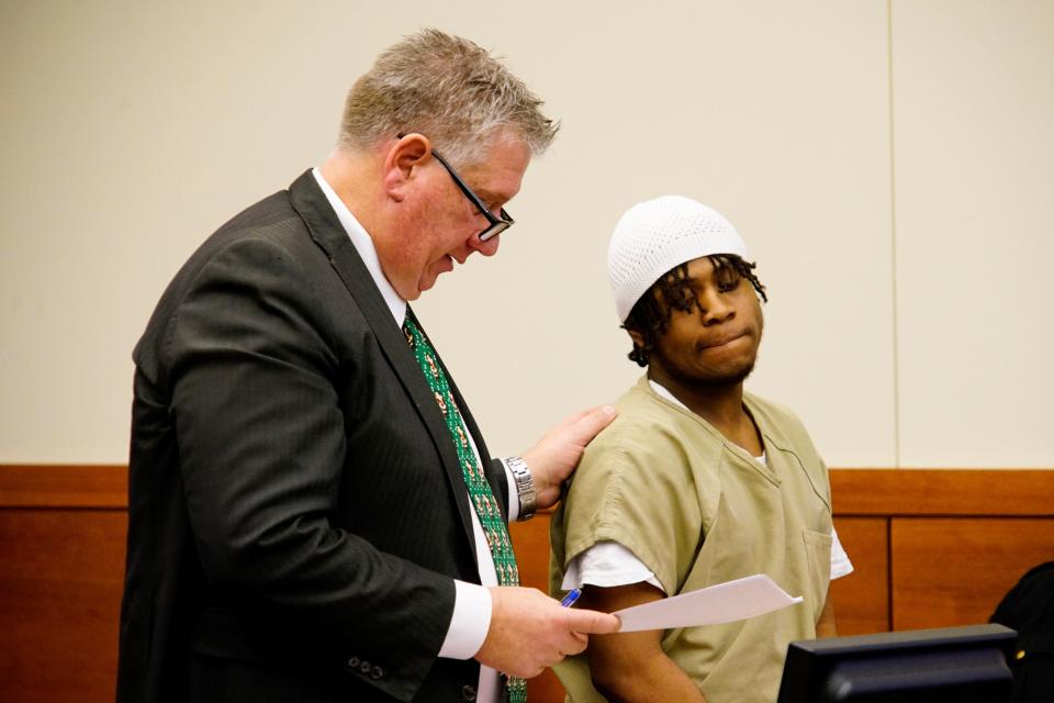Jawara Scott, 21, of Franklinton, right, was sentenced Tuesday in Franklin County Common Pleas Court to 18-23 ½ years in prison. Scott, seen standing here with his defense attorney, Mark Collins, pleaded guilty in August to two counts of aggravated robbery and one count of felonious assault for a Sept. 21, 2022, shooting that left Marissa Jones, now 34, a quadriplegic.