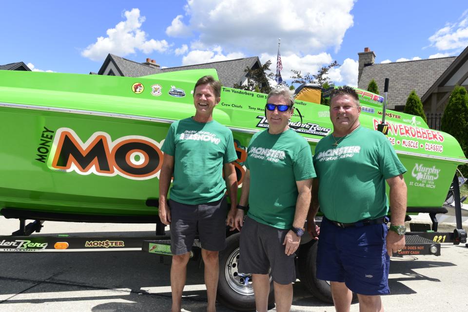 The Money Monster Offshore Racing team is seen during the 2022 St. Clair River Classic on Riverside Avenue in St. Clair on Friday, July 29, 2022. Driver Tim Vanderberg is at the far left. The team includes Vanderberg, Jeff Kipfmueller and Cliff Shaw.