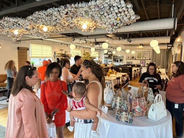 Shoppers attended the kick-off event for the partnership between luxury handbag company Brahmin and Thistle Farms. 20% of all Brahmin sales at the event were donated to Thistle Farms. Brahmin also donated 100 clutch bags to be part of a Thistle Farms gift set with proceeds going back to the non-profit.